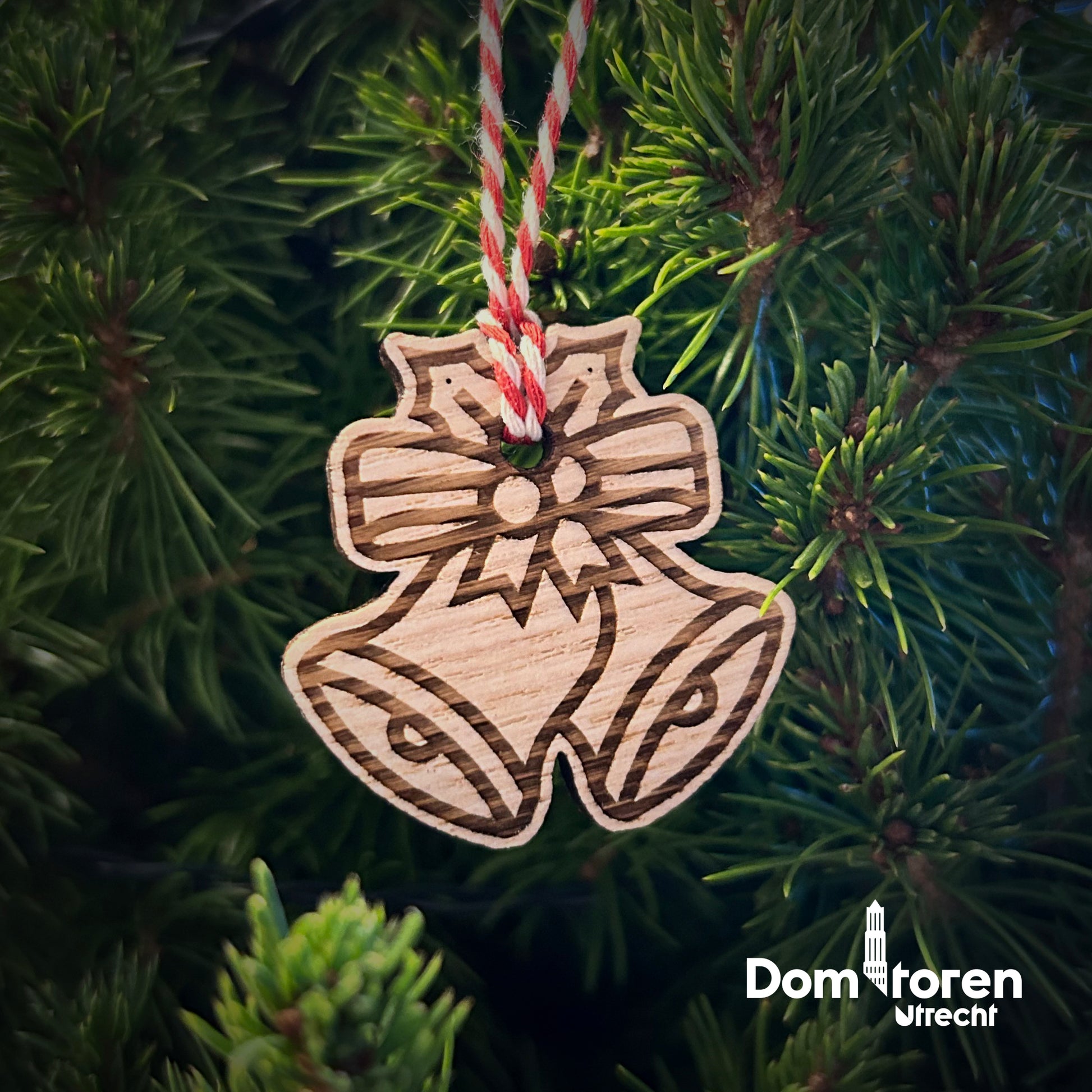 Kleine houten Domtoren-kerstklok, gemaakt van echt Domtorenhout, circulair souvenir.