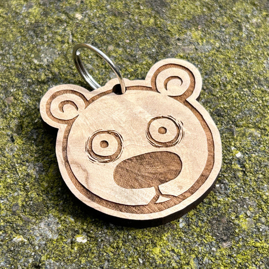 Houten sleutelhanger “Teddies in Space” (Utrechtse kunstenaar), duurzaam en speels.